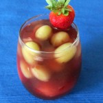 frozen fruit in cherry beverage
